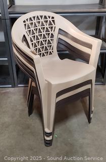 4 Stackable Brwon/Tan Plastic Chairs