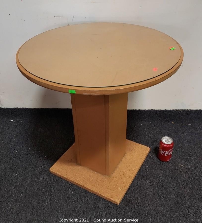 Round particle board table store with glass top