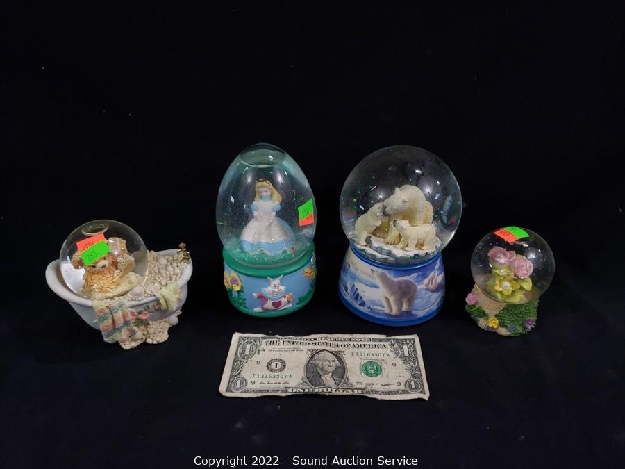 At Auction: A group of over 20 Alice in Wonderland assorted collectible