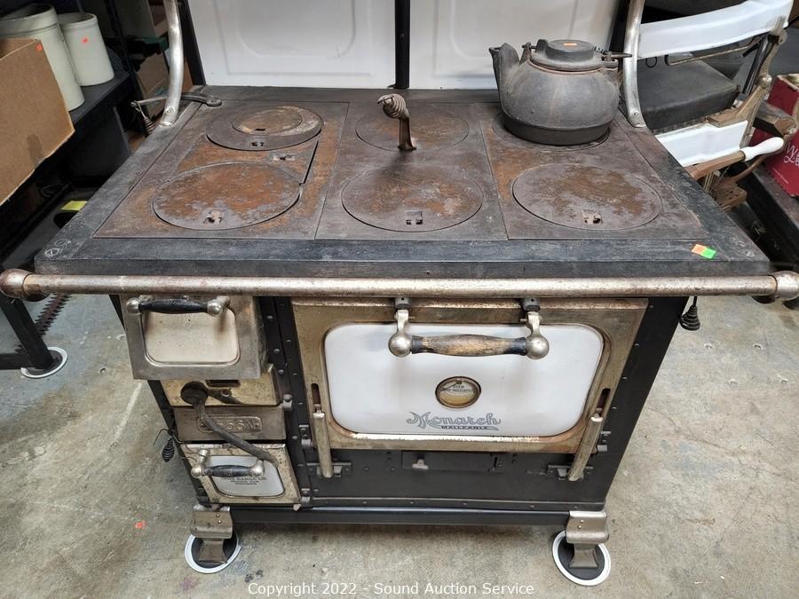 Lot - CAST IRON 'MONARCH' COOK STOVE