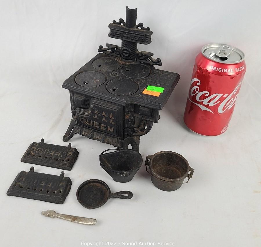 Sold at Auction: QUEEN MINIATURE CAST IRON STOVE W PANS