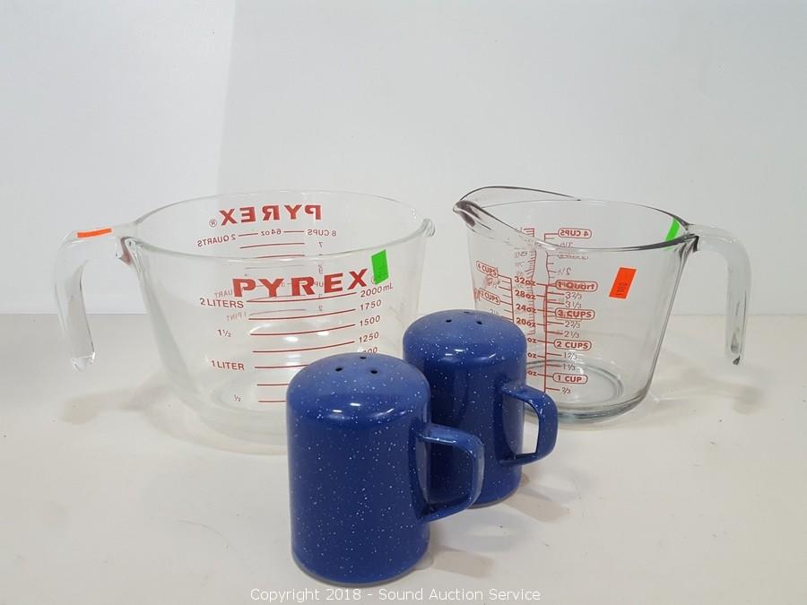 Sold at Auction: Kitchen utensils including Pyrex measuring cups