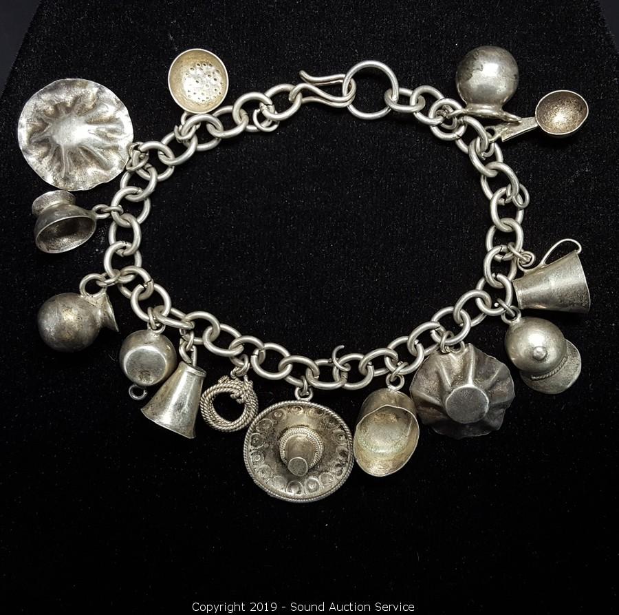 Sold at Auction: MEXICAN STERLING SILVER CHARM BRACELET